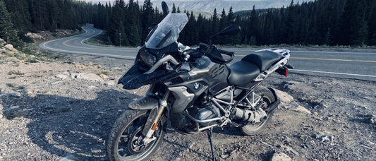 Best motorcycle seat pad for long rides: BMW R1250 GS on a mountain switchback at early morning
