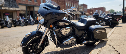Motorcycle seat cover for sun problem: Indian Chieftain parked on hot Sturgis Main Street under blazing August sky